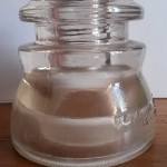 Insulators come in various colors and shapes. This is a completely transparent insulator made in USA and used for our lamps made in Argentina.